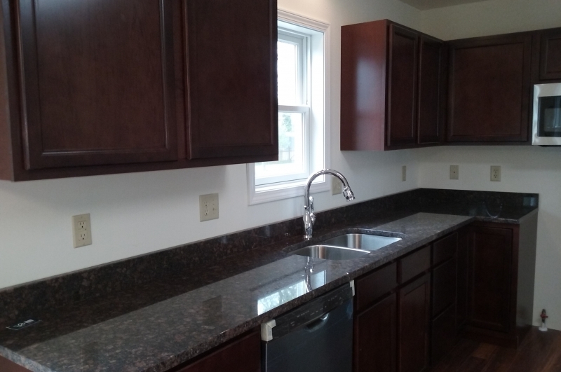 Cabinets with granite tops.
